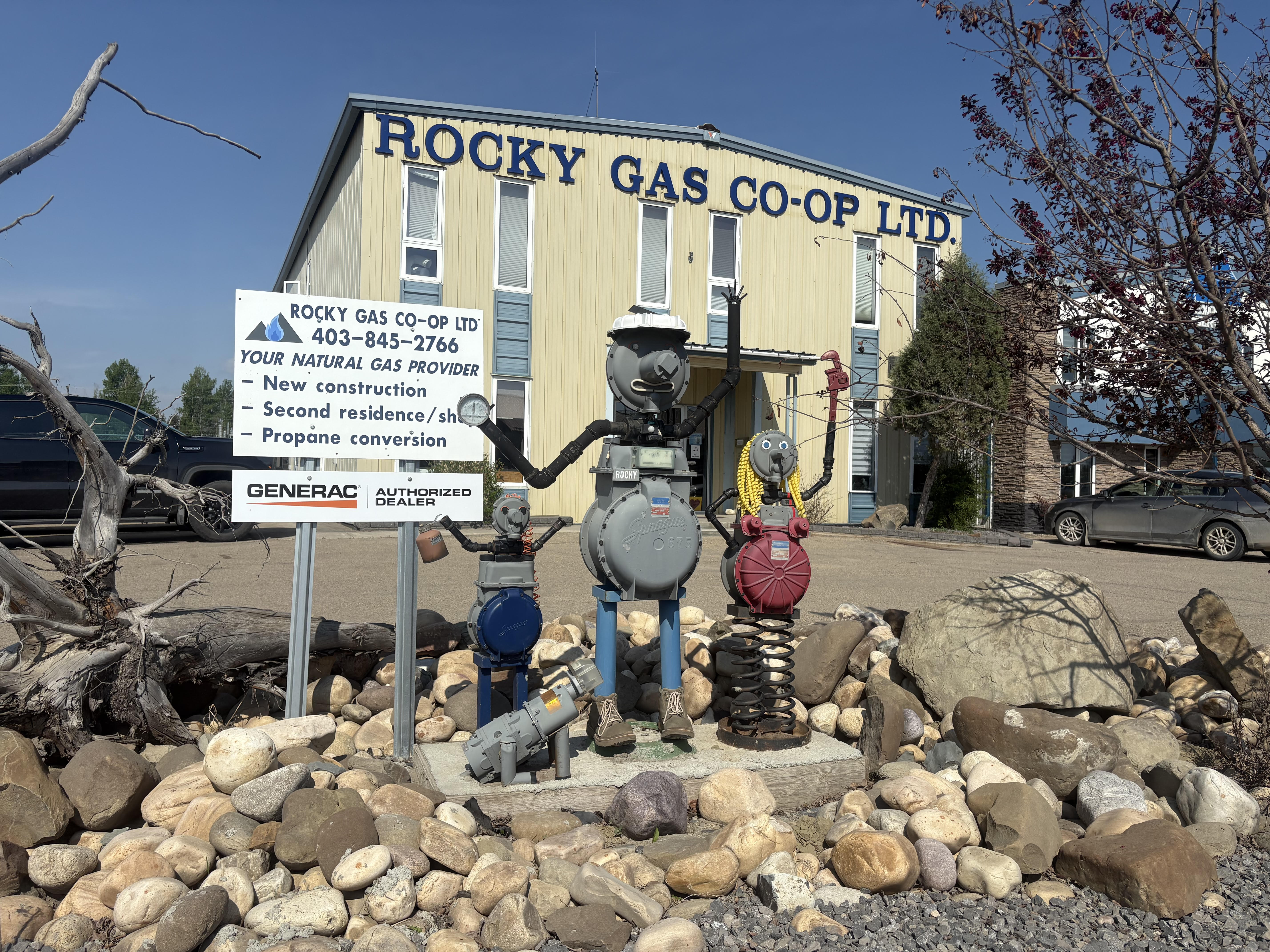 A Rocky Gas Co-op crew member with members at a natural gas meter.